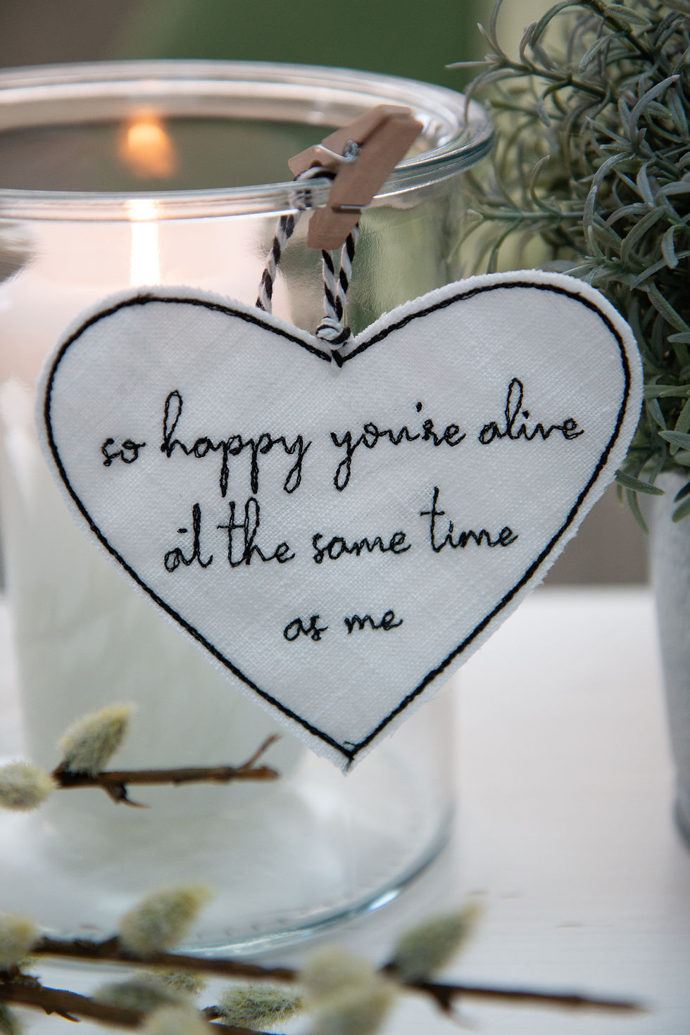 Thumbnail: White embroidered linen love heart with the text "so happy you're alive at the same time as me" written onto