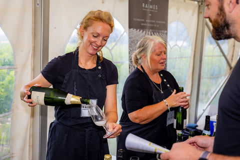 FIZZ FEST 2023 Raimes pouring glass customer .jpg