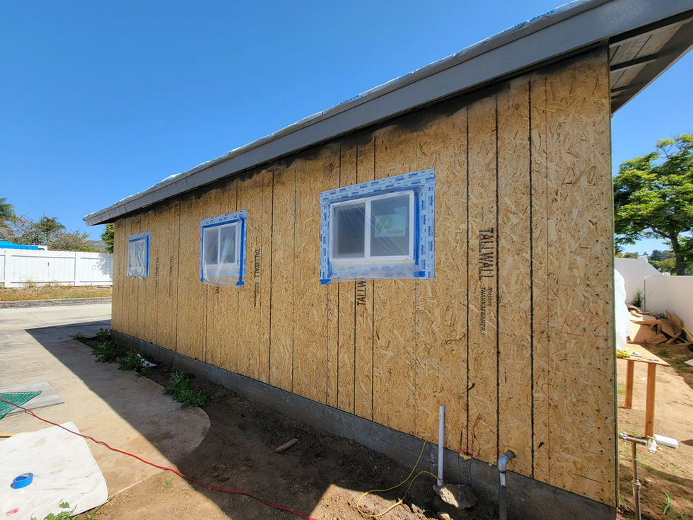 the side of a house has tallwall sheathing on it
