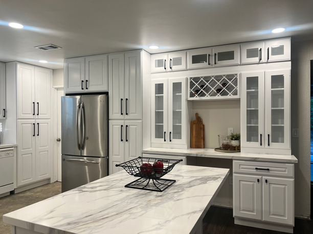 Custom built-in cabinetry featuring a wine rack and glass display doors for a San Diego home renovation.