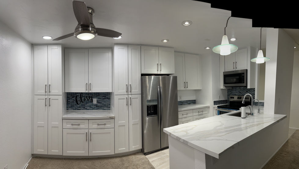 a kitchen with white cabinets and a sign that says glory