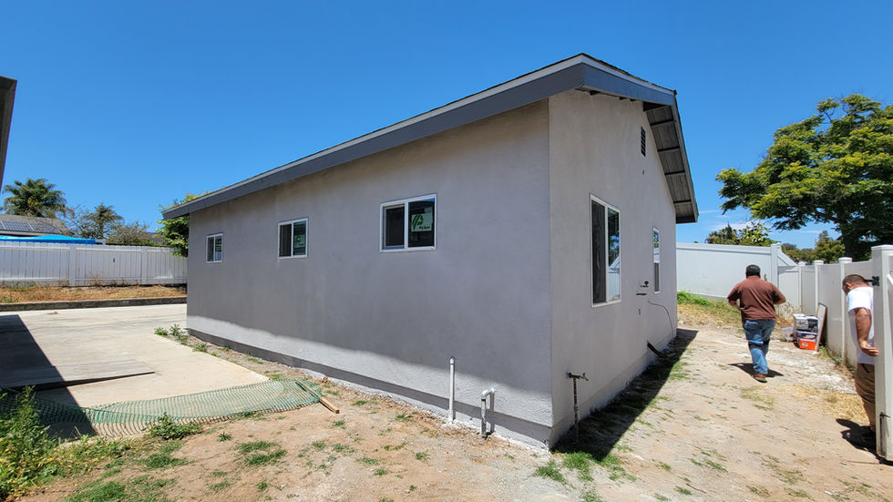 a house with a sign that says " for sale " on it