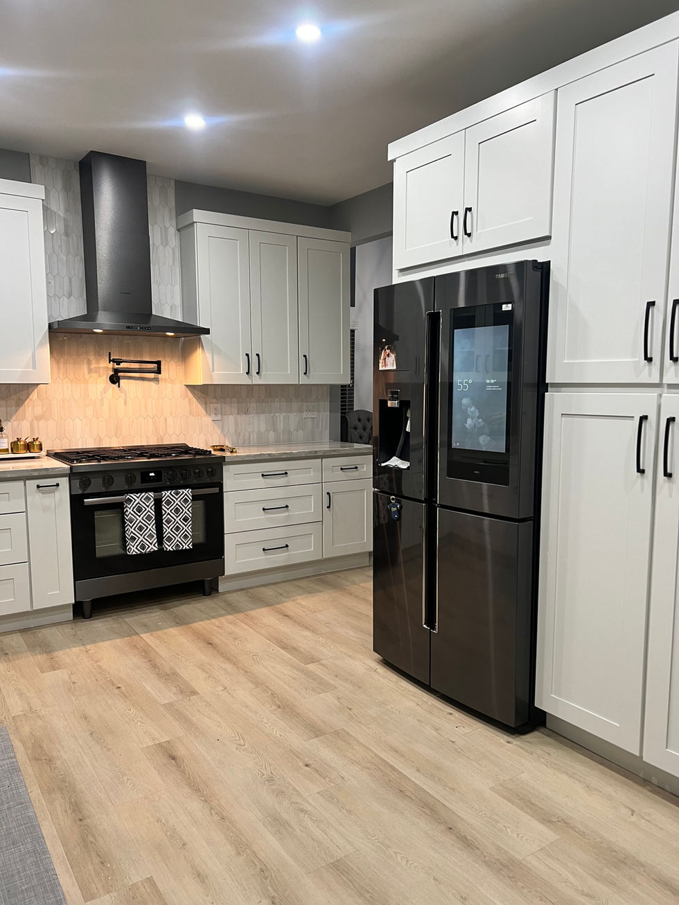 a kitchen with stainless steel appliances and white cabinets