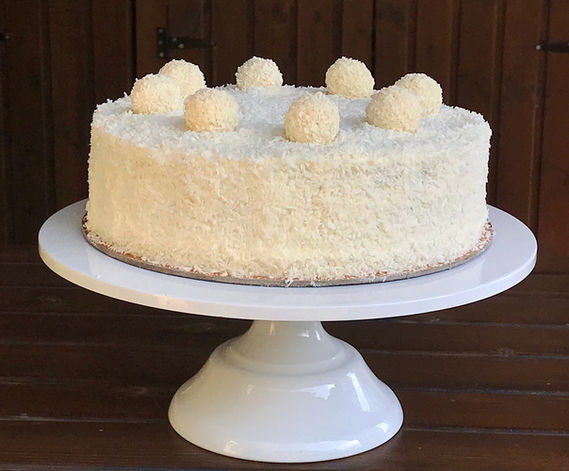Description: very light, airy sponge cake on almond flour, soaked in coconut milk with a delicate cream of coconut milk, condensed milk and whipped cream, decorated with coconut flakes and Raffaello sweets
       Price: diameter 24 cm weight: about 1700 gr - 55 euros
       Compound:
1. Almond biscuit: eggs, salt, vanilla, sugar, almond flour, wheat flour
2. Coconut cream: cream cheese, condensed milk, coconut milk, coconut flakes, powdered sugar, cream.
3. Decoration: coconut flakes, Raffaello candies.

