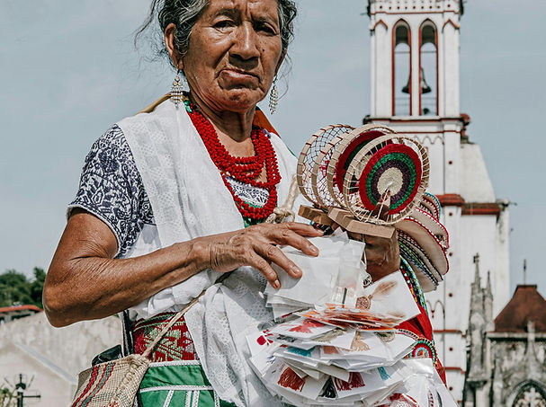Older Mexican Woman Selling Items