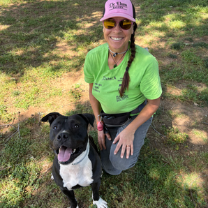 Volunteer Diana with a dog