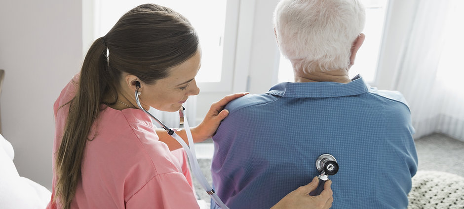Home Nurse Examining Patient