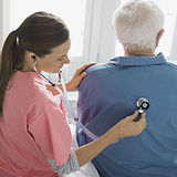 Home Nurse Examining Patient