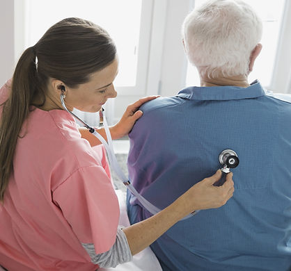 Home Nurse Examining Patient