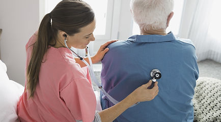 Nurse checking patient's back