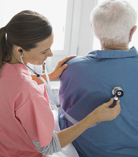 Home Nurse Examining Patient