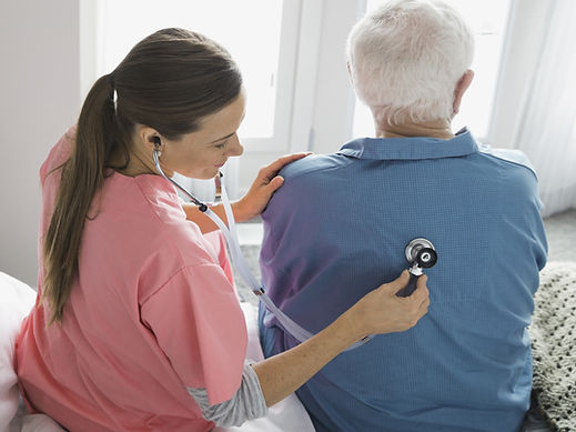 Nurse checking patient's back