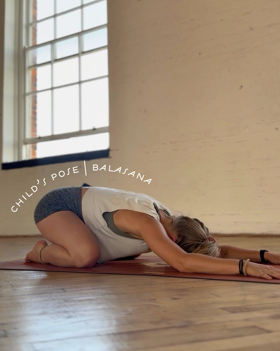 Eye-level view of a person practicing Legs Up the Wall pose in a bright, airy room