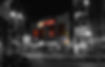 Annoyance Theatre at night in black and white with marquis sign in color