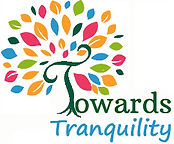 Towards Tranquilty Logo, multi coloured leaved tree with green T for trunk & Towards then Tranquility is below in light blue