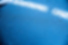 Close-up of water droplets demonstrating the hydrophobic effect on a car surface after app