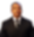 Man in a black suit and tie smiling