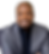 Smiling man in a grey blazer and black shirt.