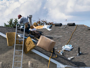 Roofer installing new asphalt shingles in Upstate SC