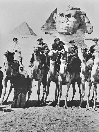 Mr & Mrs Winston Churchill, Lawrence and Gertrude Bell on camels in front of the Sphinx.