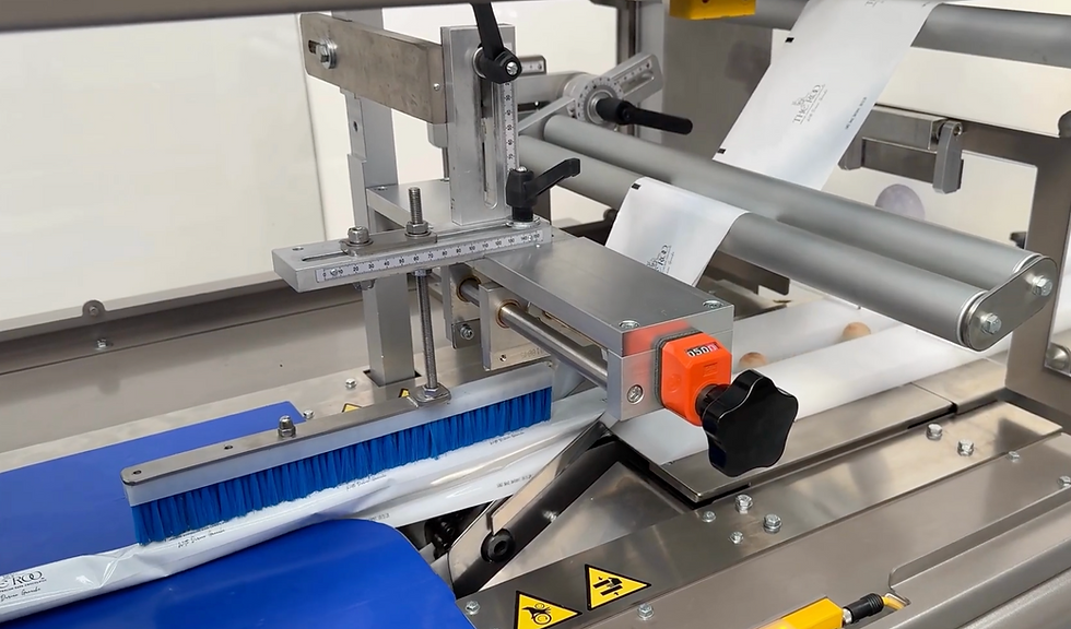 Real customer flow wrapper installation supplied by PacMatix using a GSP flow wrapper to package chocolate products in a food manufacturing environment.