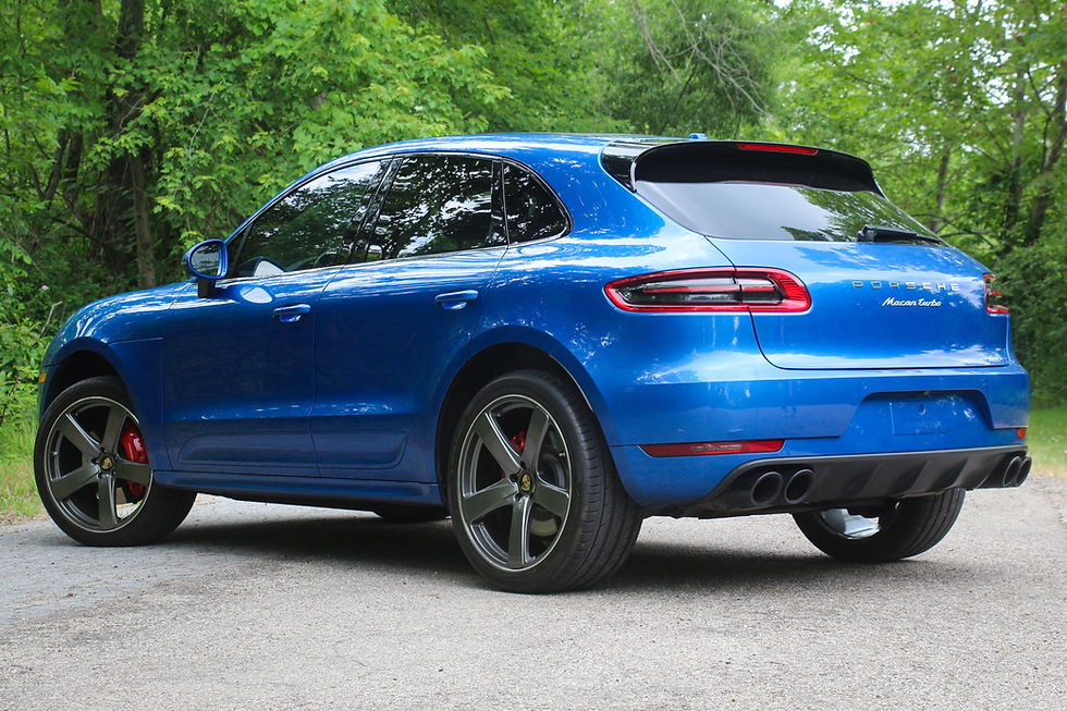 Rear three-quarter view of a blue 2016 Porsche Macan Turbo