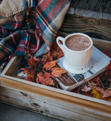 Warm and cozy with coffee blanket book chair comfort space