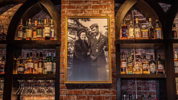 Husband and wife image on the bar.
