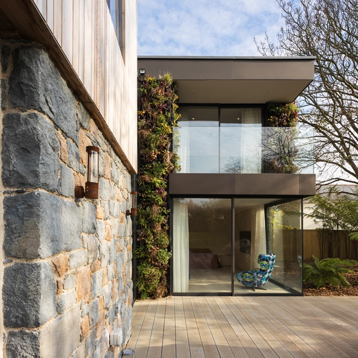 Image of "The Glade" residential house, highlighting the use of local materials and craftsmanship, demonstrating DLM Architects' commitment to supporting sustainable life cycle costs.