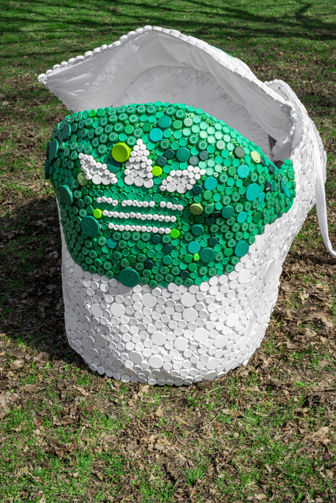 Briony Douglas created a 8ft long sculpture of the Adidas Stan Smith sneaker entirely of recycled materials in celebration and to raise awareness for a more sustainable future.