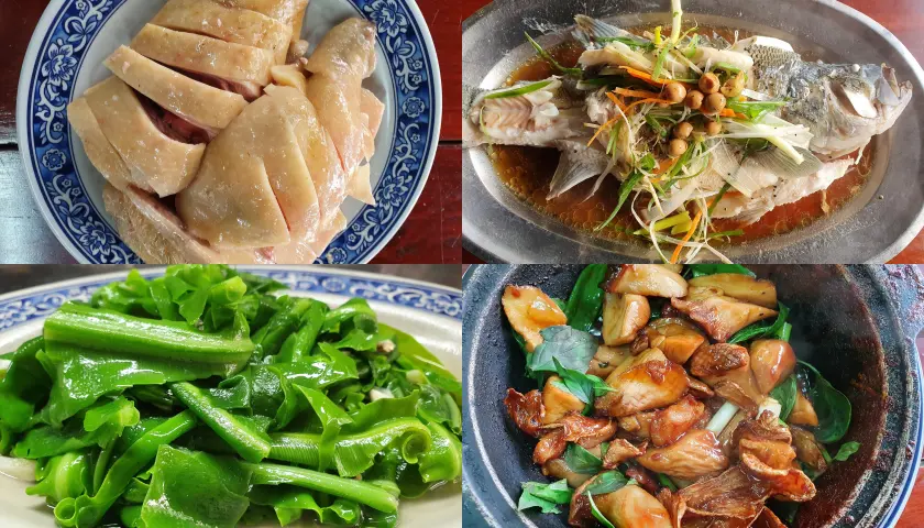 左上藍色盤子裝有油雞，右上則是清蒸魚，左下為清炒山蘇，右下是三杯杏鮑菇
