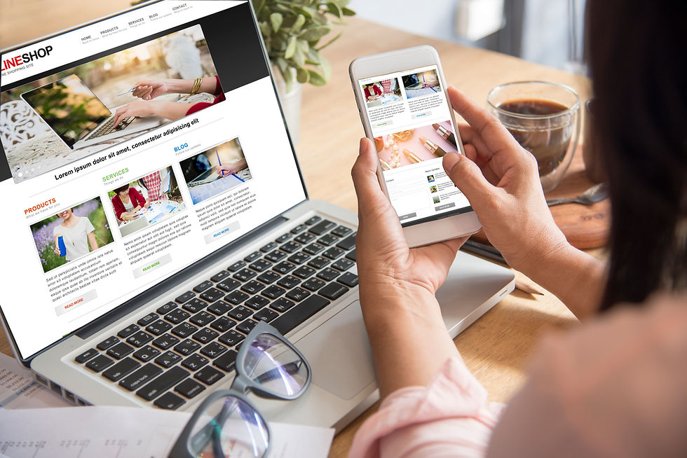 A person uses a phone beside a laptop showing the LINESHOP shopping site at a desk with coffee and glasses.