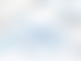 White desk with keyboard, smartphone, and SEO word cloud; blue marketing terms like keywords, traffic, and links.