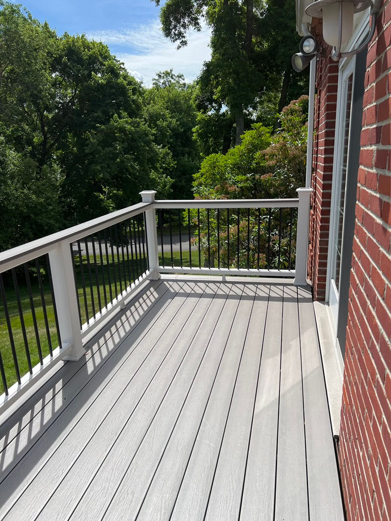 New deck construction build with moisture shield decking and Trex transcend rails with cocktails rails in Easton, CT.