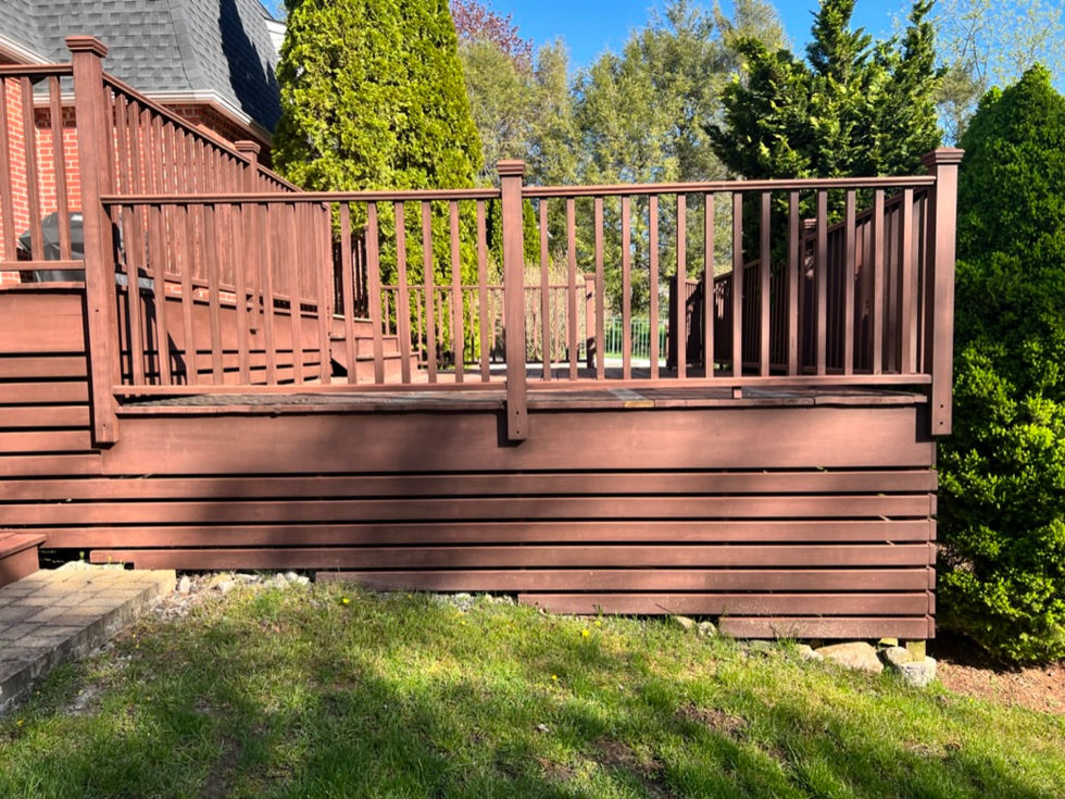 New deck construction build with moisture shield decking and Trex transcend rails with cocktails rails in Easton, CT.