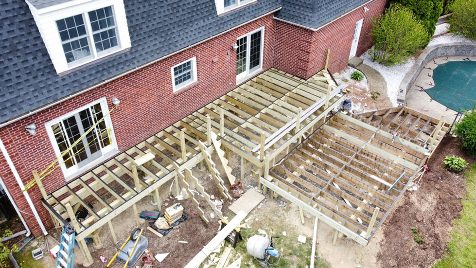 New deck construction build with moisture shield decking and Trex transcend rails with cocktails rails in Easton, CT.