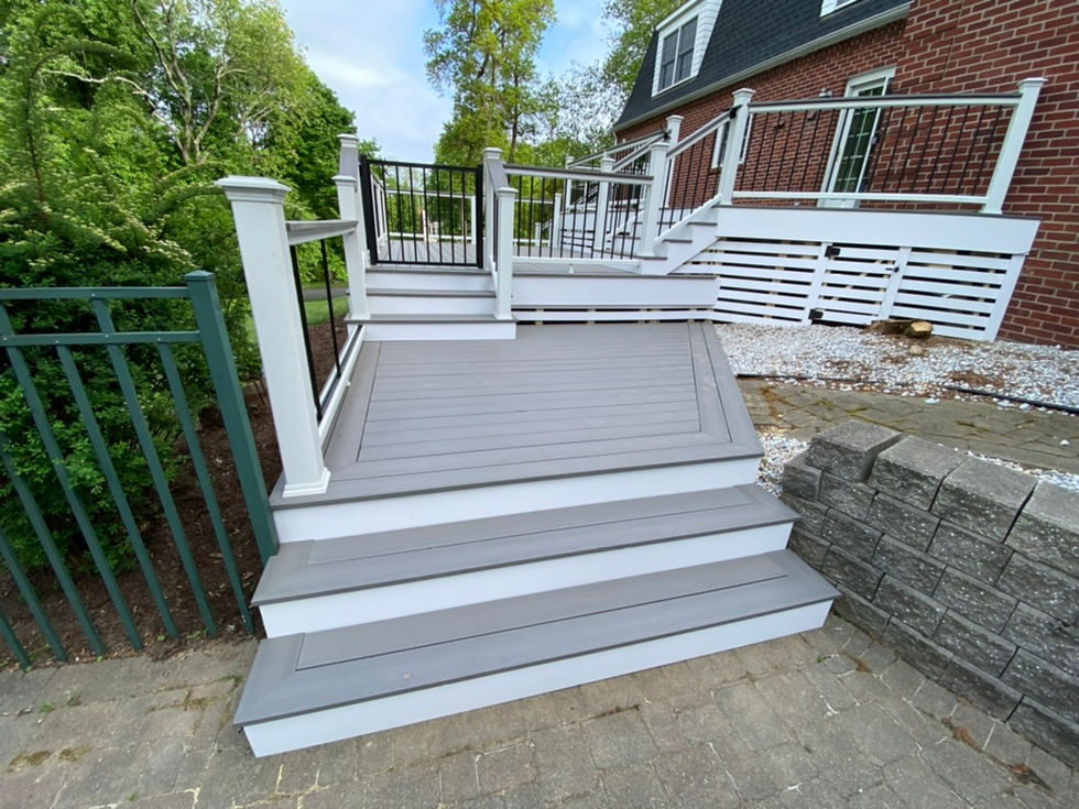 New deck construction build with moisture shield decking and Trex transcend rails with cocktails rails in Easton, CT.