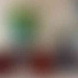 A chic lobby area in Landmark Pinnacle featuring modern furniture, large abstract paintings, and a relaxed ambiance.