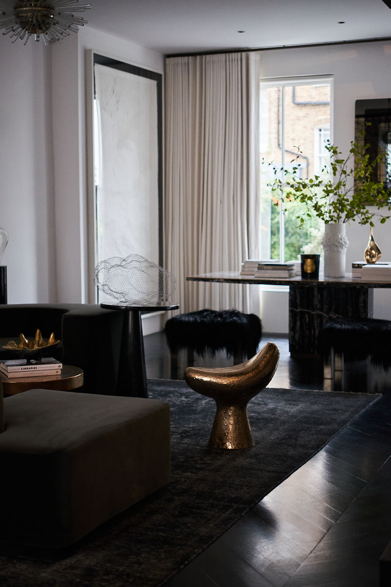 Modern interior living room with gold details and luxurious sofa