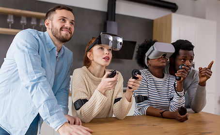 Students using VR headset with mentor
