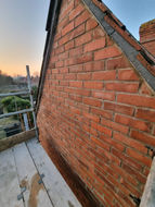 red brick house repointed gable end
