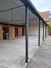 exterior anti rust paint on car port in black matte finish, country farm