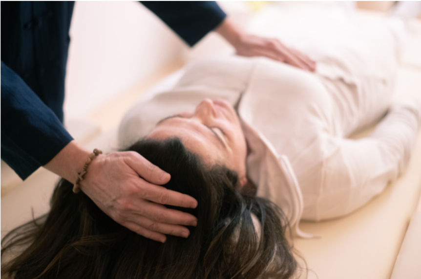 Reiki master using hands to restore harmony and inner peace