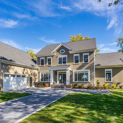 Roadside image of a custom home design in St. Michaels. This waterfront home was designed by Home Builder, Paquin Design Build. 
