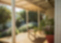 Split verandah roof with iron and shade cloth.