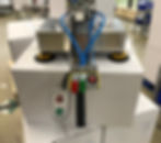 A carton is handled by the balancer ezzFLOWpneumatic which meets the requirements of hygiene and ergonomics within the food industry.