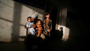An inmate of Drug Treatment and Rehabilitation Center meet his children after they came to visit him in Kabul.