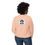 Thumbnail: Woman wearing a peach sweatshirt with a round logo on the back.