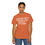 Thumbnail: Woman wearing orange t-shirt with the text COUNTRY GIRL printed on it.