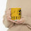 Thumbnail: Person holding a yellow mug that says: "DICK'S PISTOL MOUNTAIN" and "Wake up!"